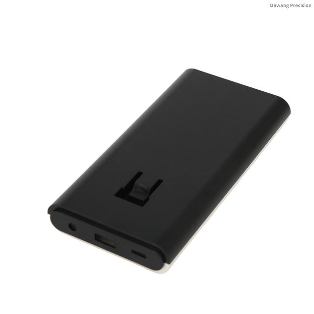 Custom white ABS-PC power bank enclosure bottom view showing speaker grilles, battery compartment and precise structural ribs