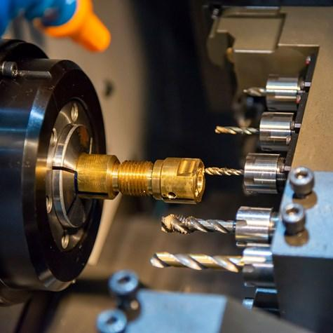Swiss lathe machining of miniature medical screws with guide bushing support.png