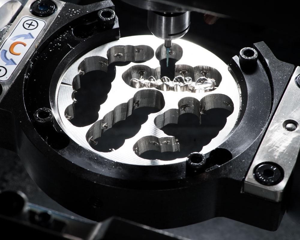 Five-axis CNC machining of complex titanium custom prosthetics and dental implant components.jpg