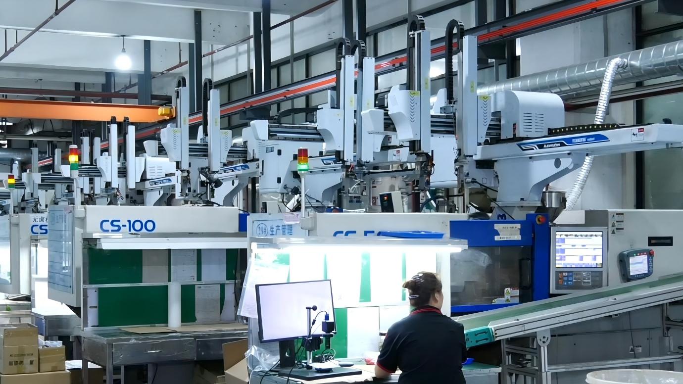 Precision injection molding workshop with plastic molding machines for custom production