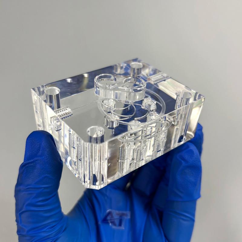 CNC machined acrylic manifold with transparent fluid channels for in-vitro diagnostic equipment.jpg